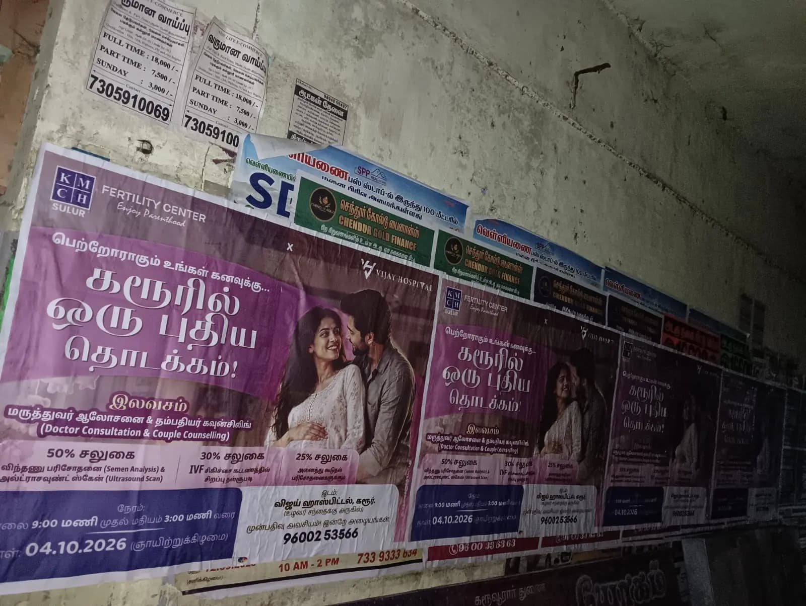 Close-up of pink campaign posters on wall